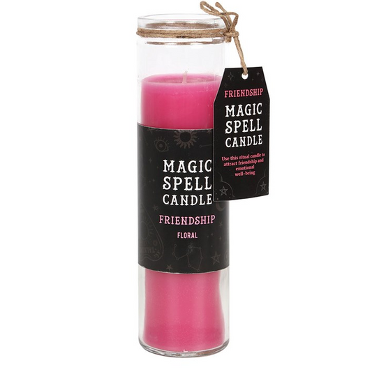 Pink spell candle in a glass jar with a black label on a white background
