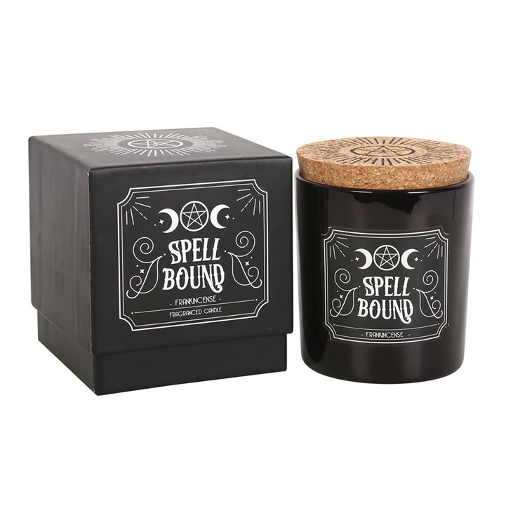 Black candle with cork lid and decorative box labeled 'Spell Bound' on a white background