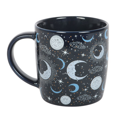 Black mug with celestial design on a white background