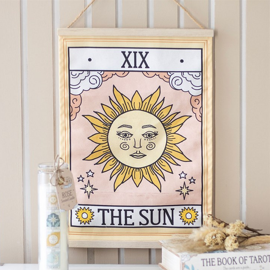 Framed tarot card print titled 'The Sun' with decorative elements on a neutral background.