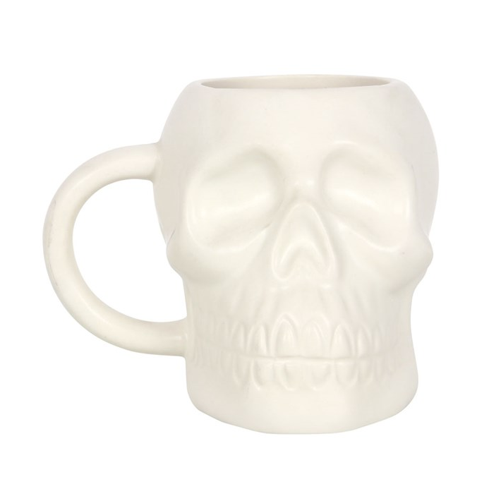 White skull-shaped mug on a white background