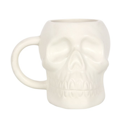 White skull-shaped mug on a white background