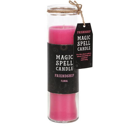 Pink spell candle in a glass jar with a black label on a white background