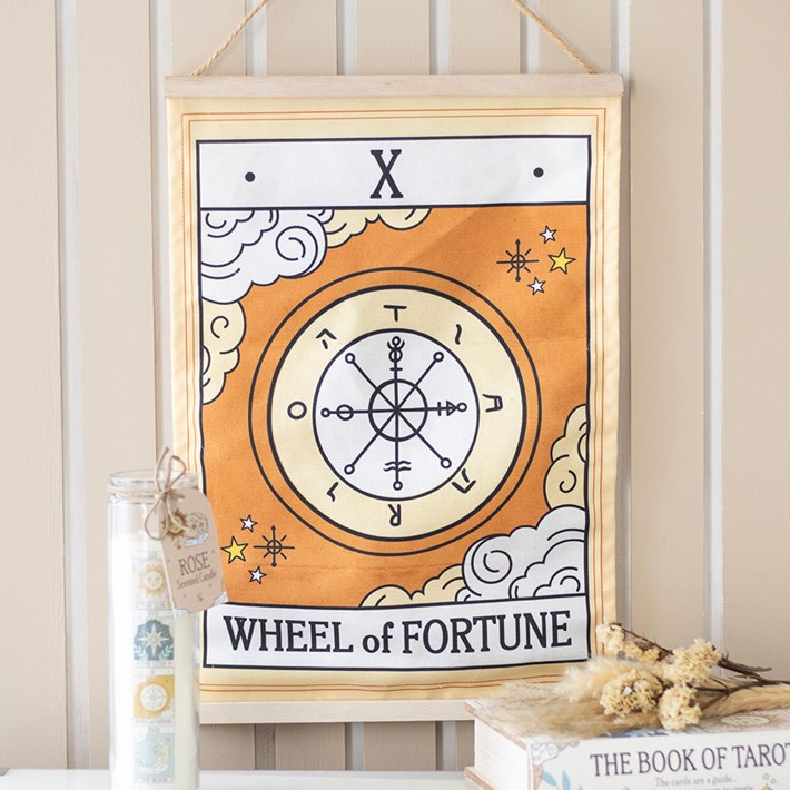 Framed artwork with 'Wheel of Fortune' design on a shelf.