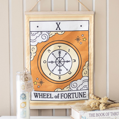Framed artwork with 'Wheel of Fortune' design on a shelf.