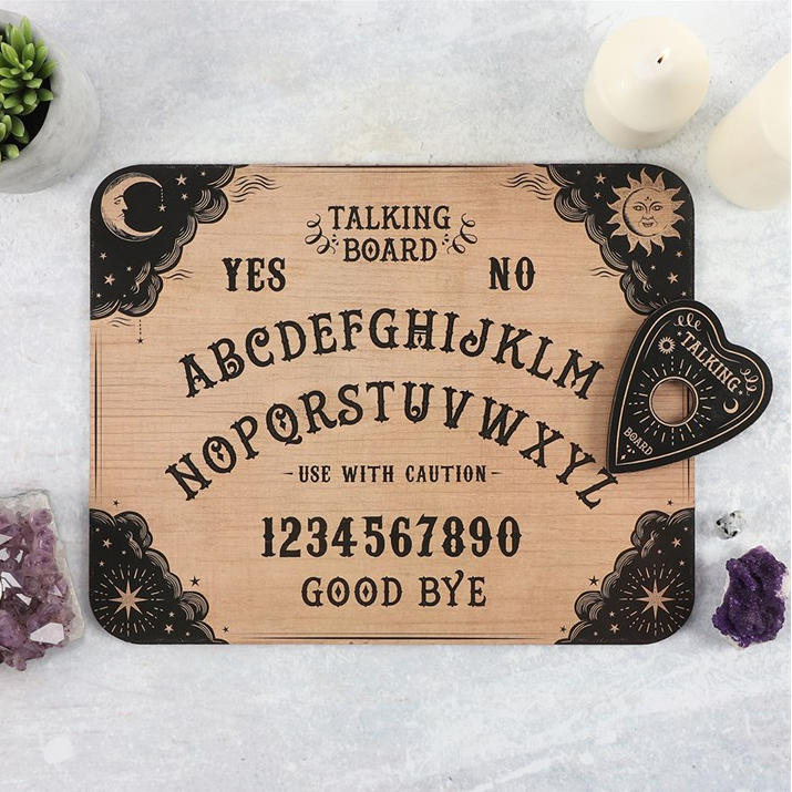 Wooden Ouija board with black text and symbols on a white background