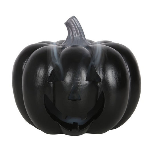Black pumpkin-shaped container with a face on a white background