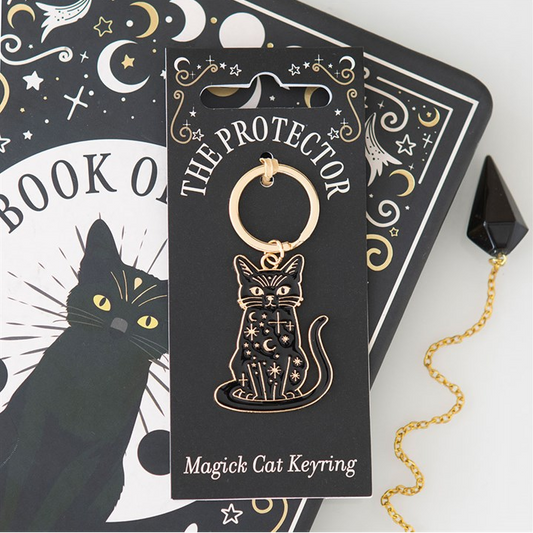 Magick cat keyring packaging with black cat illustration on a white background