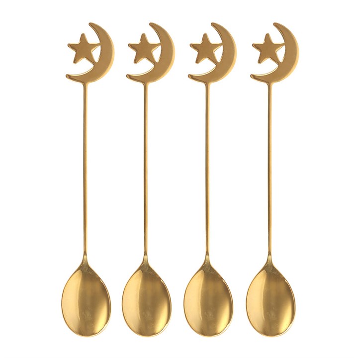 Four gold spoons with moon and star designs on a white background