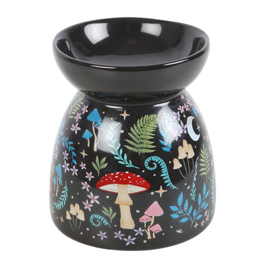 Black ceramic oil burner with fairy tale design on a white background