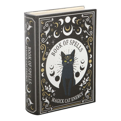 Book titled 'Book of Spells: Magick Cat Energy' with a black cat illustration on a white background