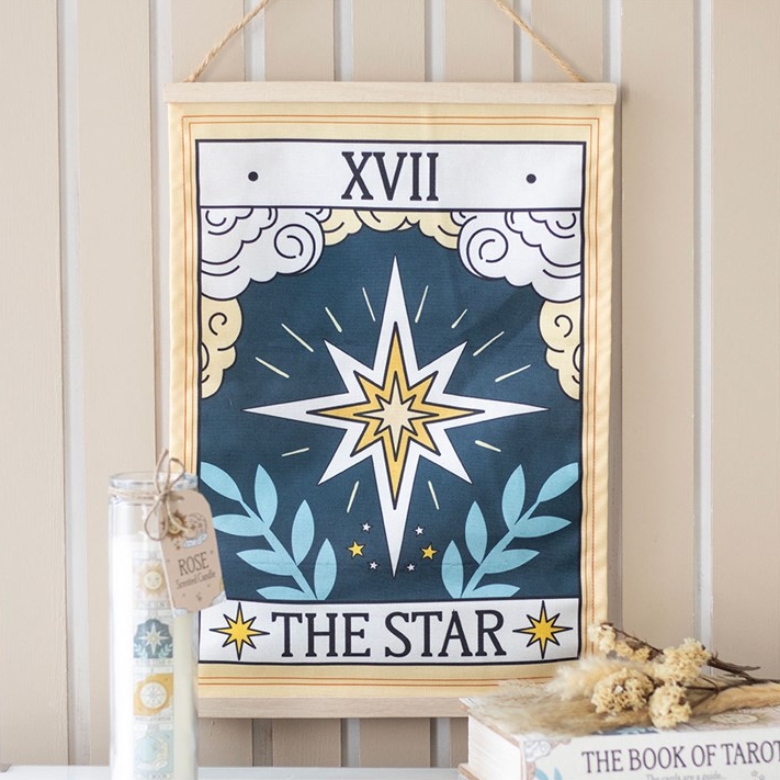 Framed tarot card titled 'The Star' with decorative elements on a neutral background