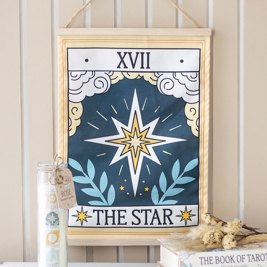 Framed tarot card titled 'The Star' with decorative elements on a neutral background