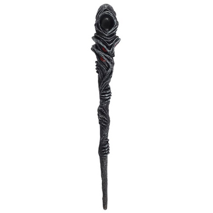 Black decorative staff with intricate design on a white background