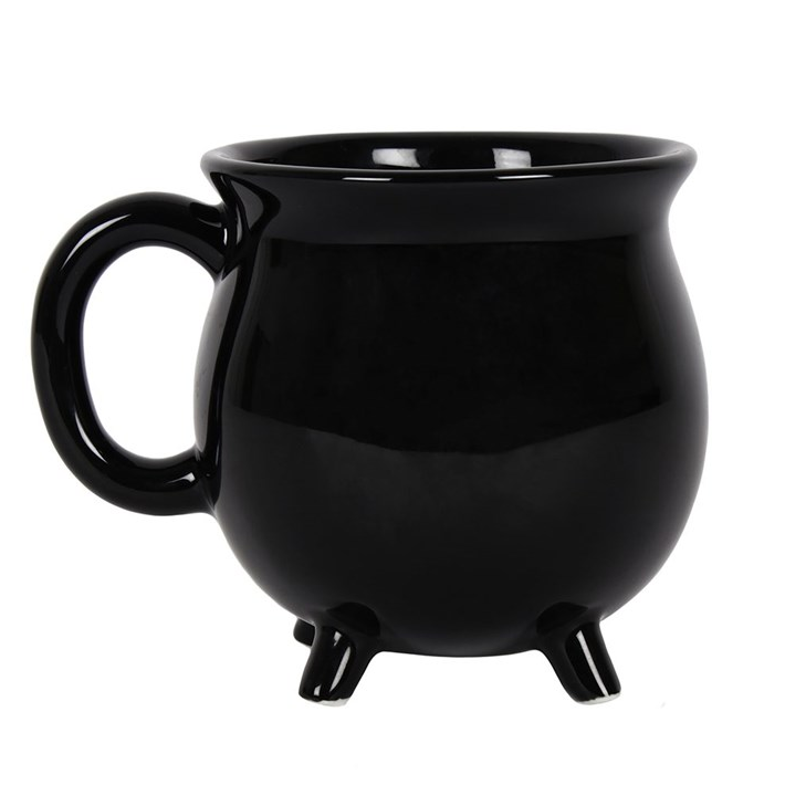 Black mug with footed base on a white background