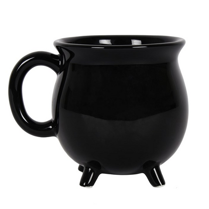 Black mug with footed base on a white background