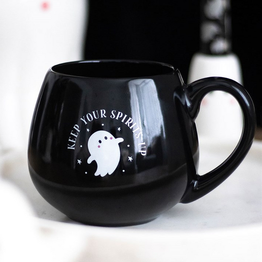Black mug with ghost design and text on a white background
