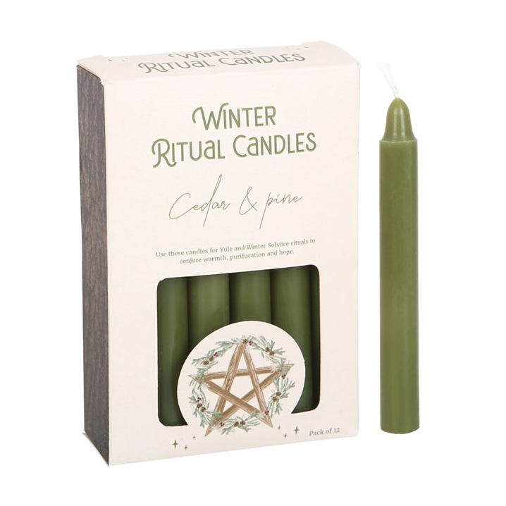 Green candle with packaging labeled 'Winter Ritual Candles' on a white background