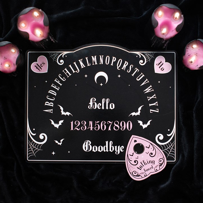 Decorative blackboard with Halloween-themed design on a dark background with pink lights.