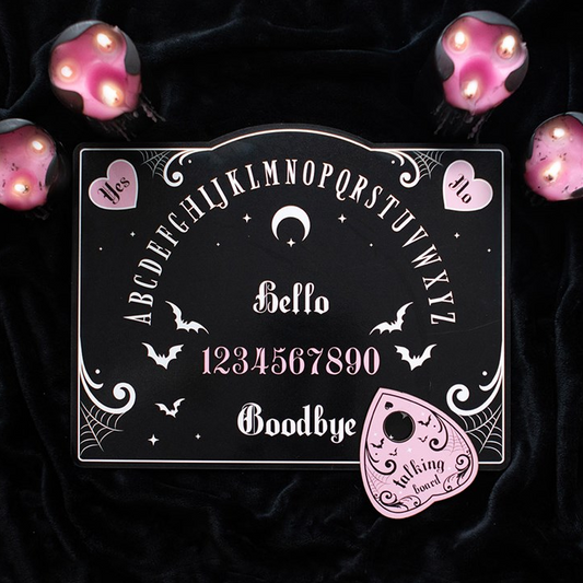 Decorative blackboard with Halloween-themed design on a dark background with pink lights.