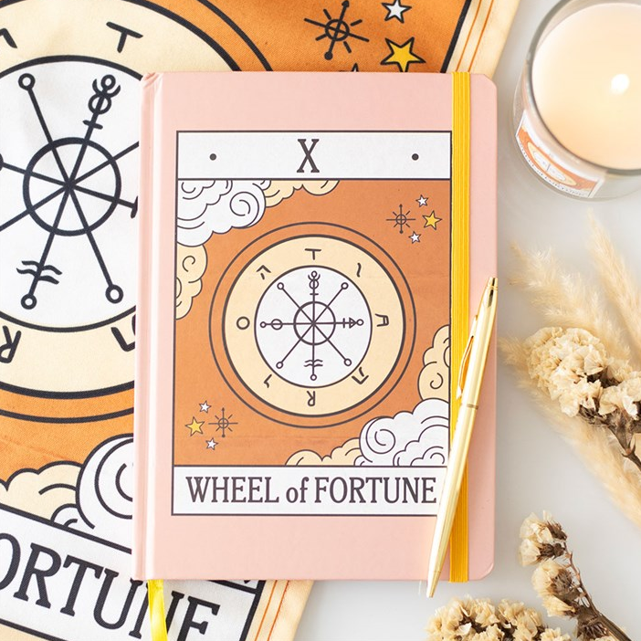 Notebook with 'Wheel of Fortune' design on a white background