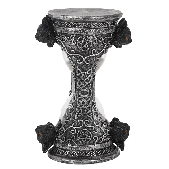 Decorative hourglass with intricate designs on a white background