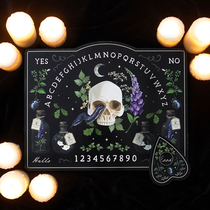 Ouija board with skull and bottles design on a dark background with lights.