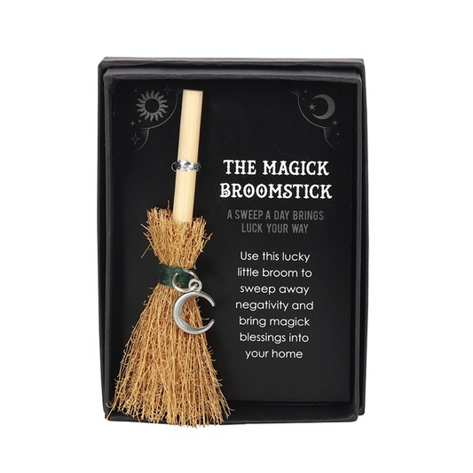 Magickal broomstick with packaging on a white background